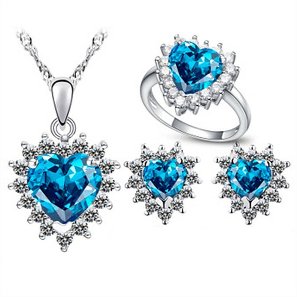 Schmuckgarnitur aus aus goldplattierter Legierung mit blauem Emporia®-Kristall und weißem Emporia® Kristall