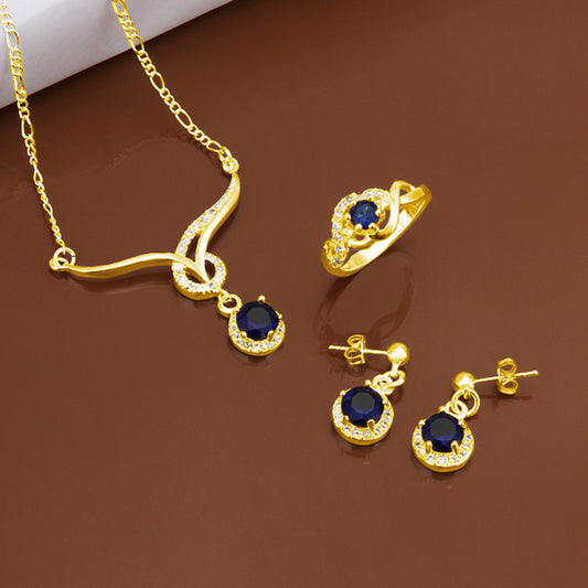 Schmuckgarnitur aus aus goldplattierter Legierung mit blauem Emporia®-Kristall