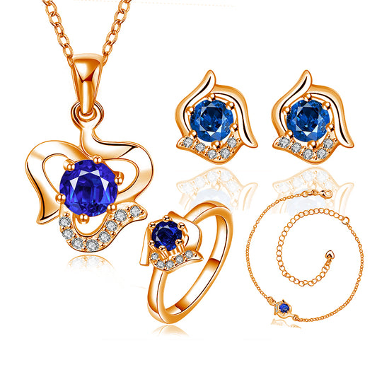 Schmuckgarnitur aus aus goldplattierter Legierung mit blauem Emporia®-Kristall