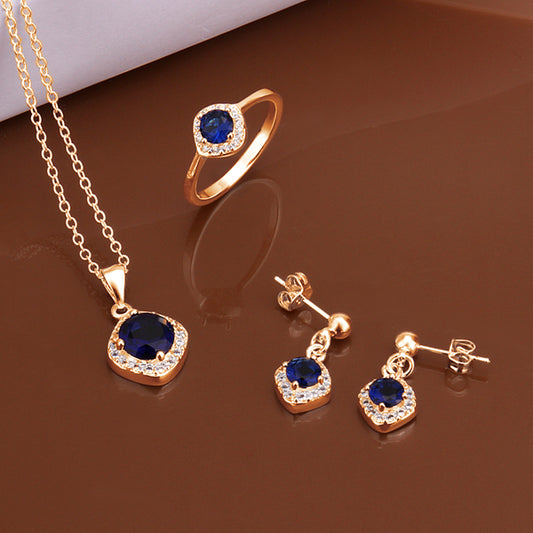 Schmuckgarnitur aus aus goldplattierter Legierung mit blauem Emporia®-Kristall