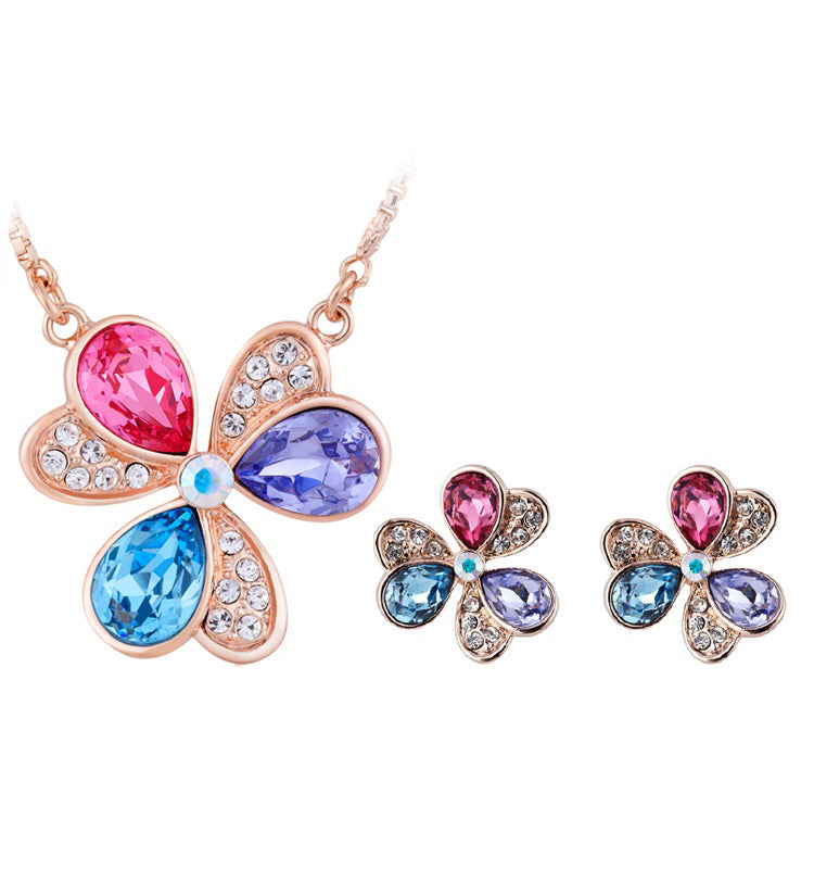 Schmuckgarnitur aus aus goldplattierter Legierung mit rotem Emporia®-Kristall