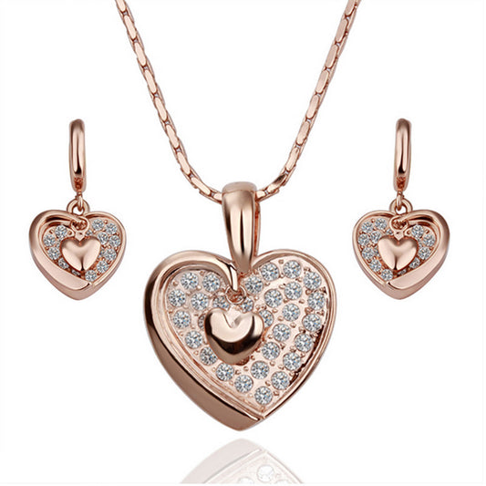 Schmuckgarnitur aus aus goldplattierter Legierung mit weißem Emporia® Kristall