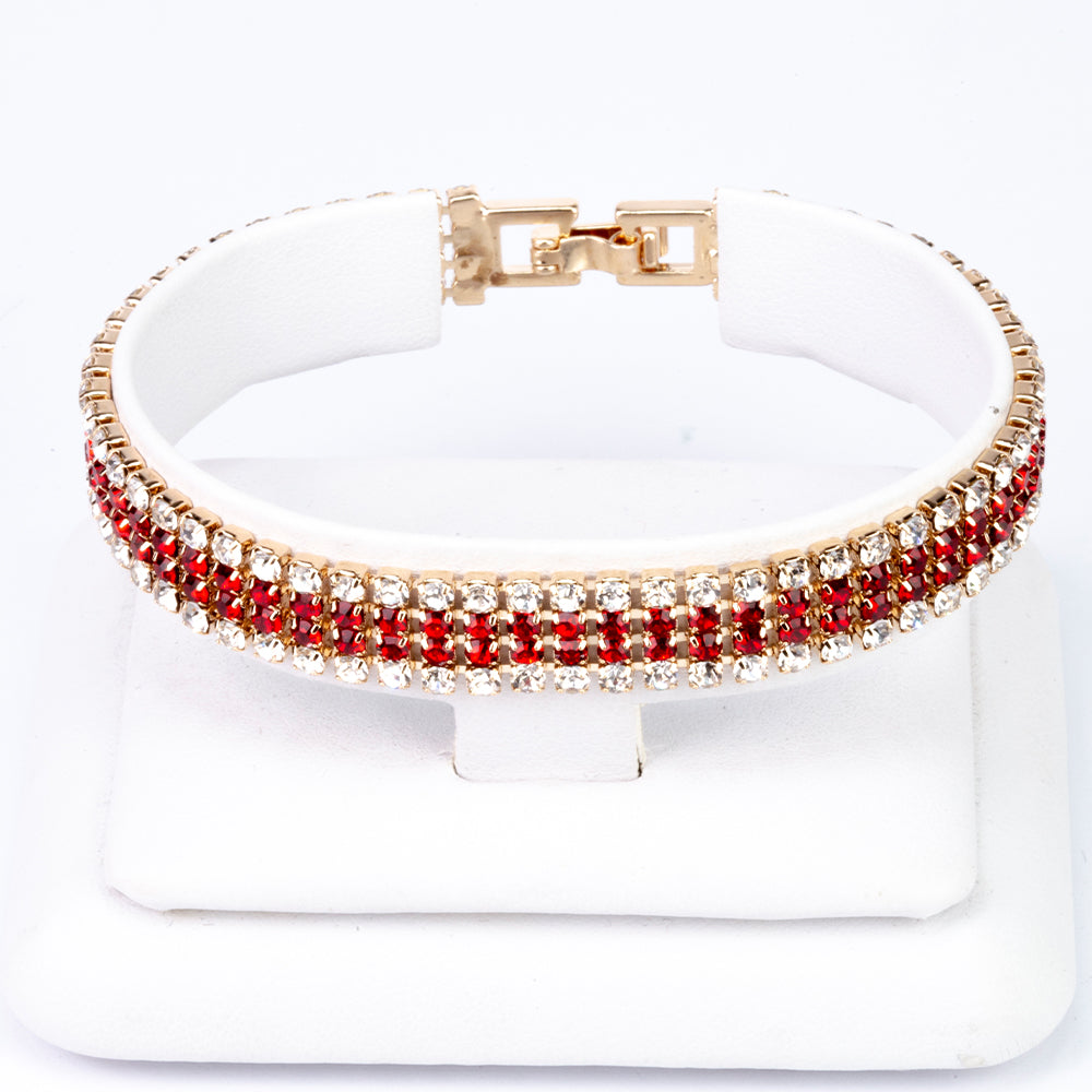 Uhr aus goldplattierter Legierung mit rotem Emporia®-Kristall