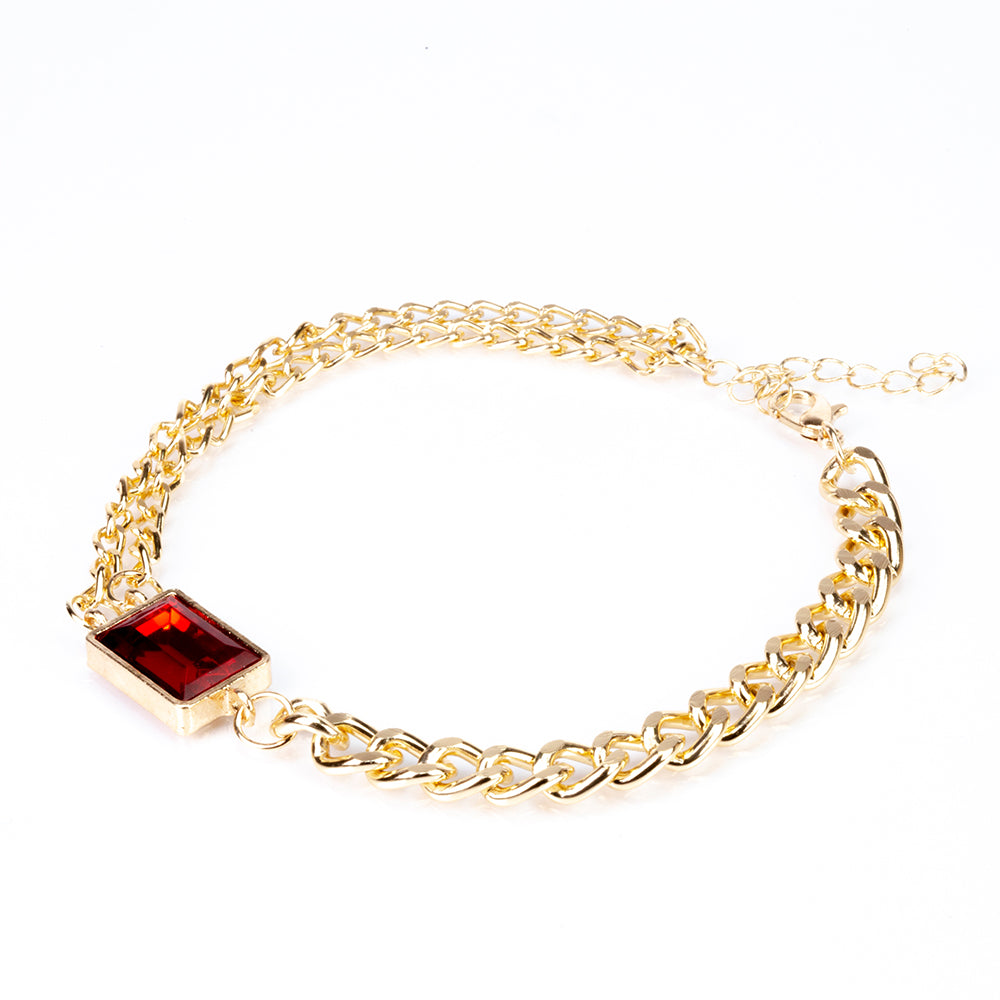 Uhr aus goldplattierter Legierung mit rotem Emporia®-Kristall 8 