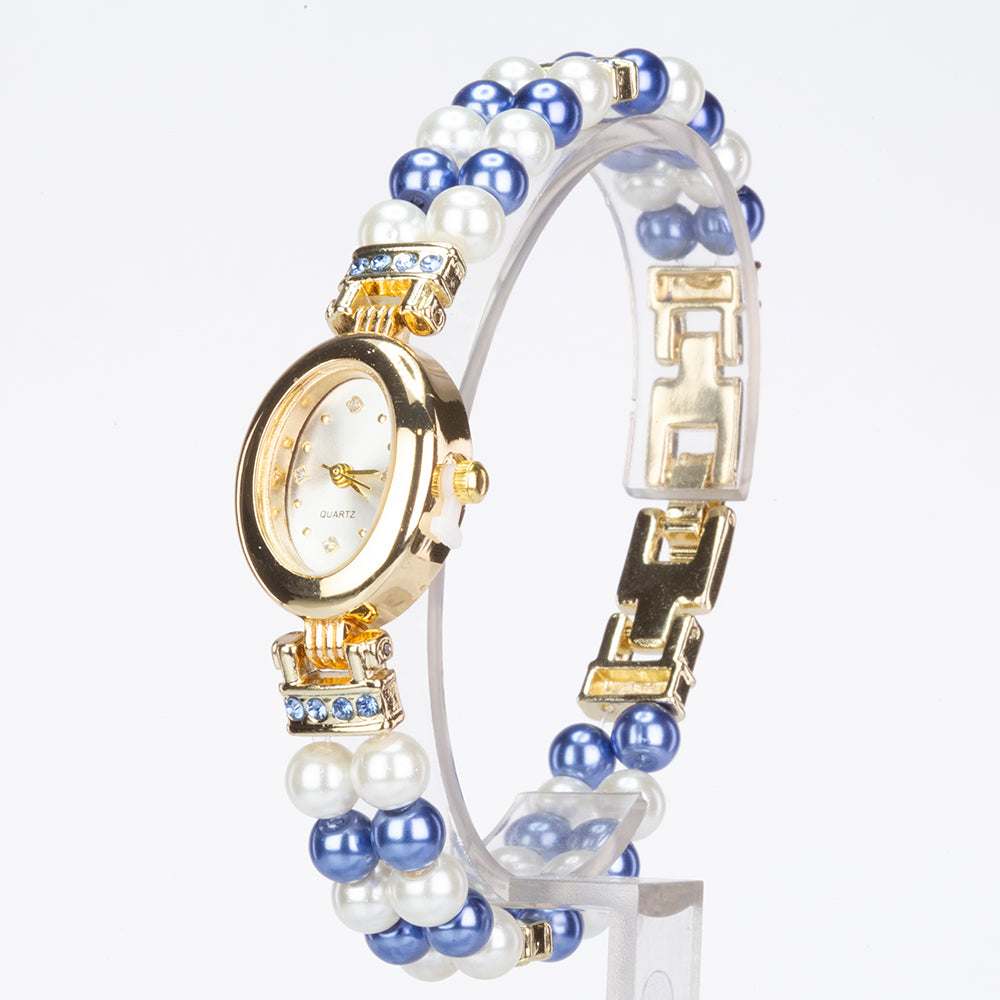 Schmuckgarnitur aus aus goldplattierter Legierung mit weißer Perle und blauem Emporia®-Kristall