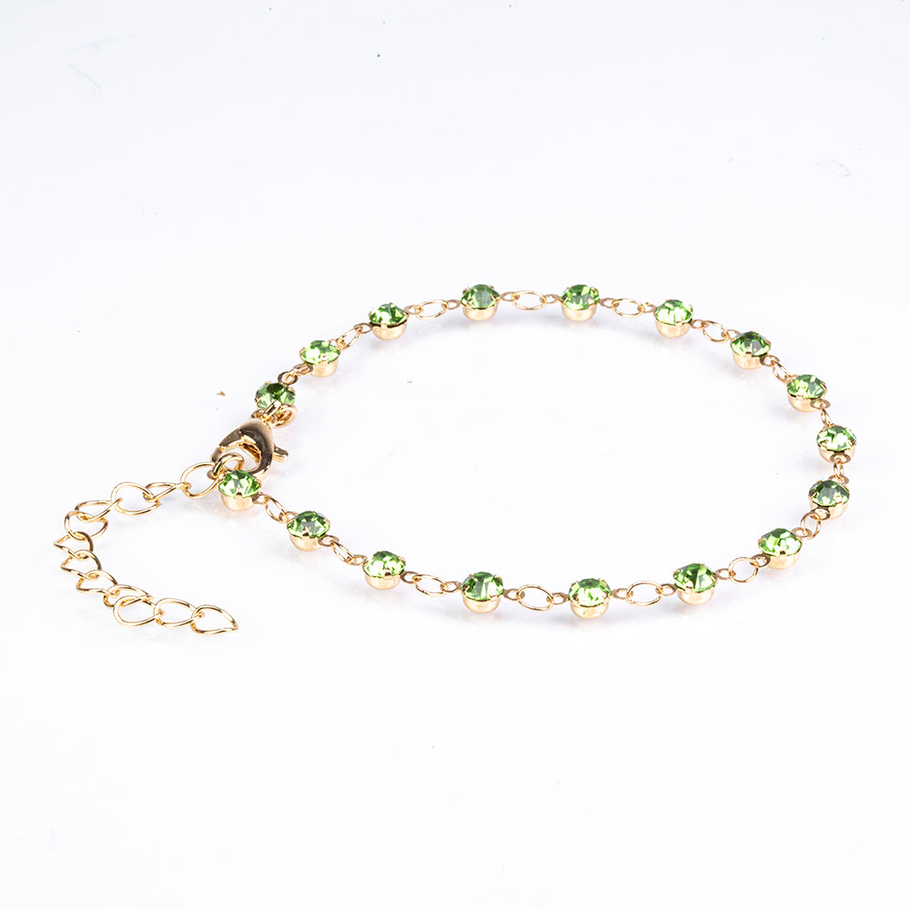 Schmuckgarnitur aus aus goldplattierter Legierung mit Emaille und grünem Emporia® Kristall 6 