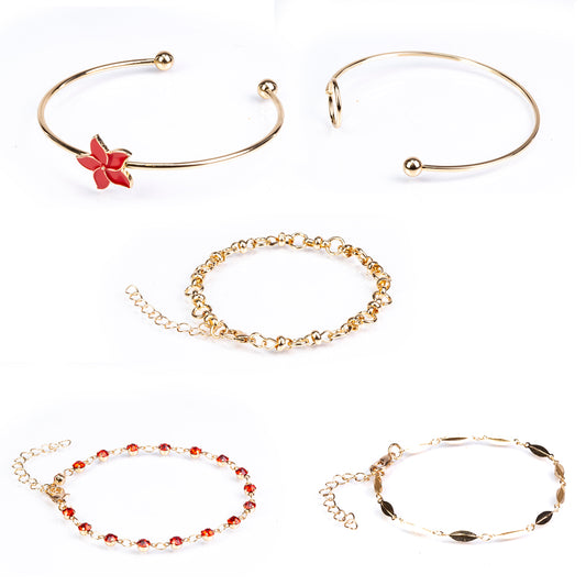 Schmuckgarnitur aus aus goldplattierter Legierung mit Emaille und rotem Emporia®-Kristall